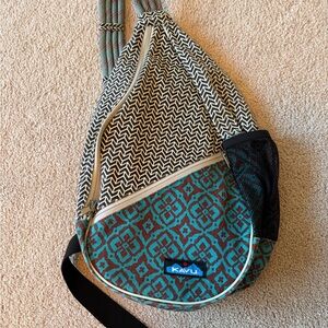 Kavu Teardrop Sling Bag in Teal, Brown and Cream Geometric Mix
